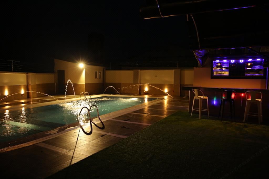 The Kiniz pool lit at night